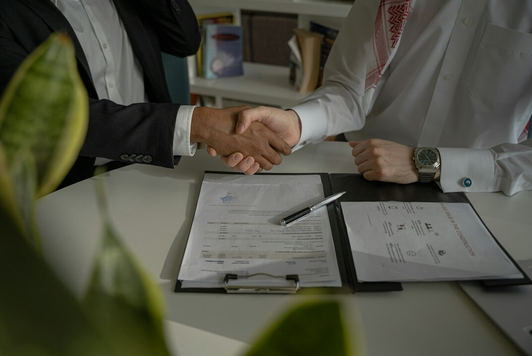 business handshake in meeting