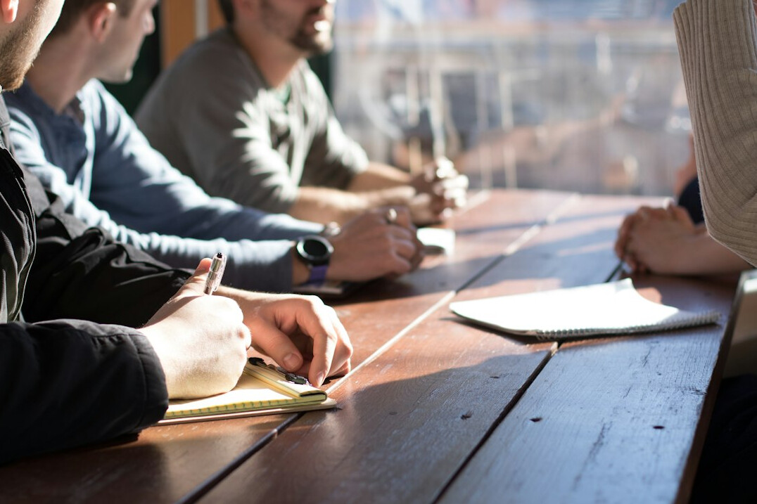 person sharing ideas in meeting