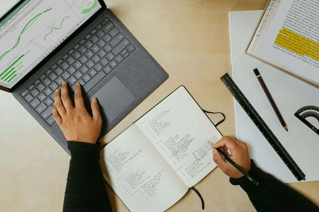 person analyzing data on laptop